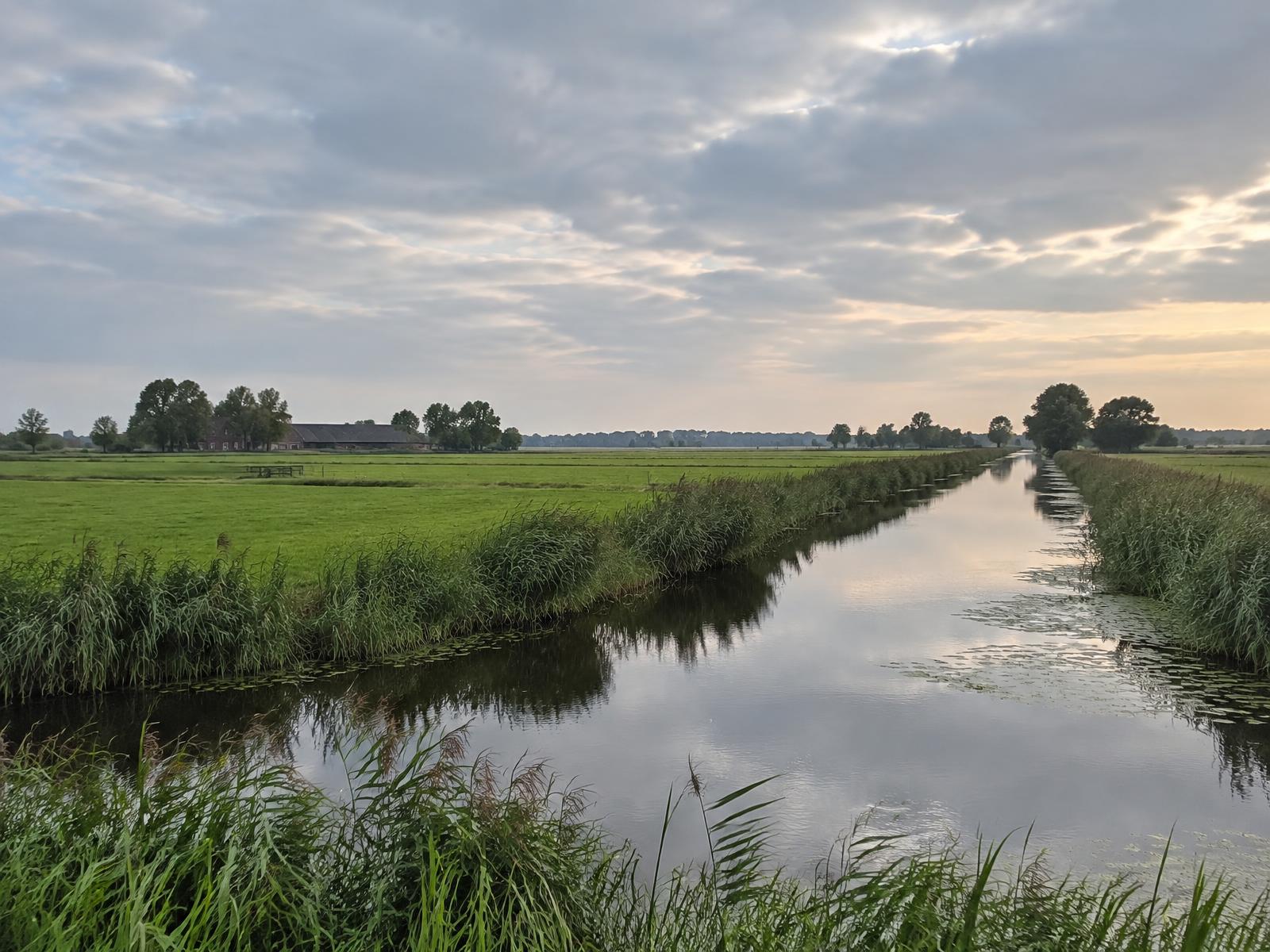 A quiet canal and fields in the northern Netherlands